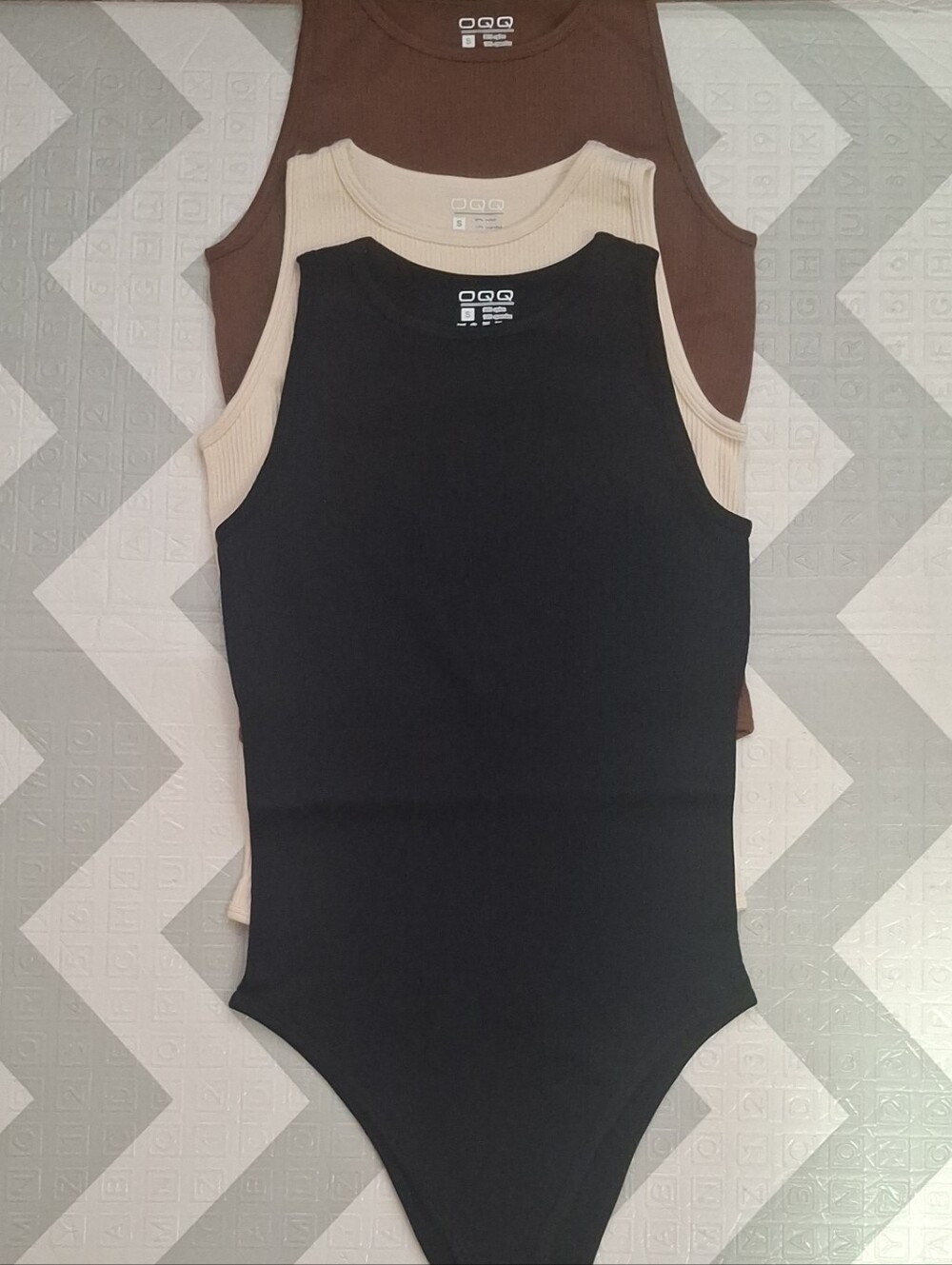 Women set of three sleeveless ribbed bodysuits from the OQQ brand SIZE SMALL